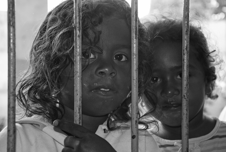 young girls behind bars black and white